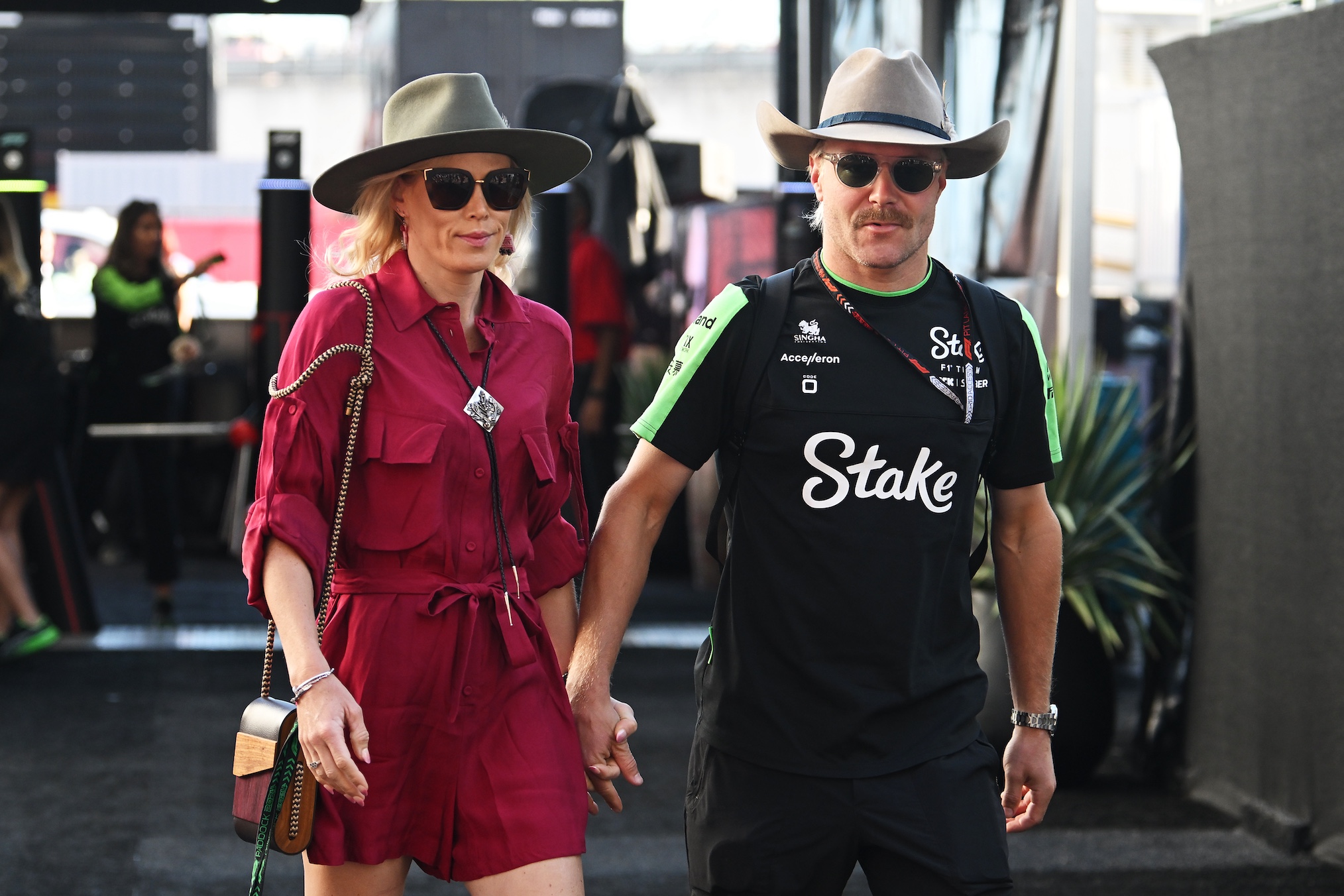 Valtteri Bottas of Finland and Stake F1 Team Kick Sauber and Tiffany Cromwell walk in the Paddock prior to the F1 Grand Prix of United States at Circuit of The Americas on October 20, 2024 in Austin, Texas.