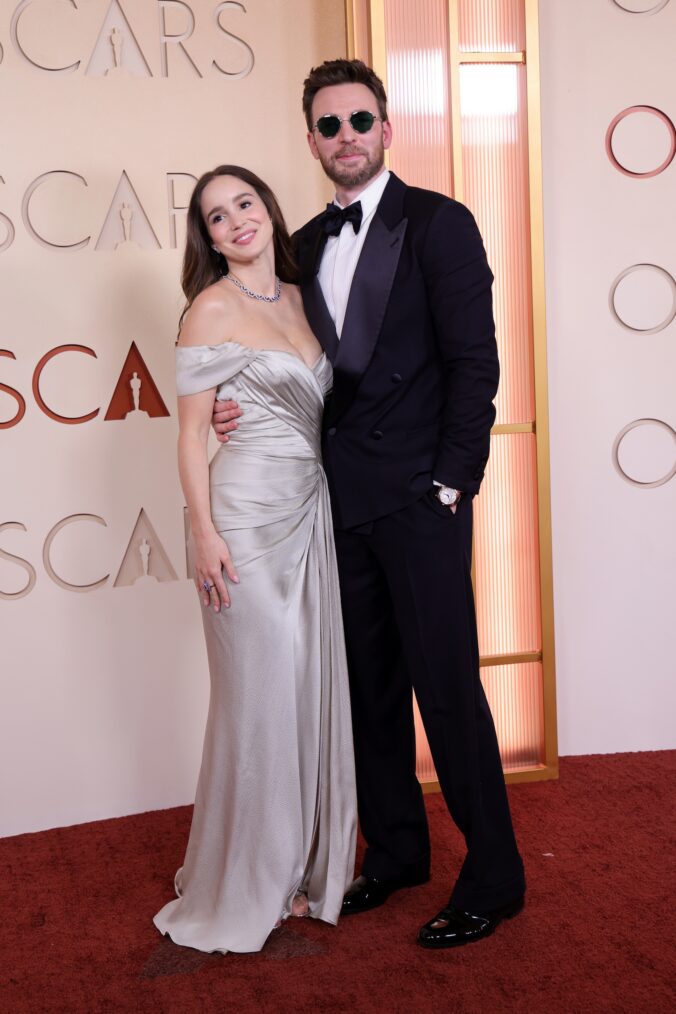 Alba Baptista and Chris Evans attend the 98th Oscars at Dolby Theatre on March 15, 2026 in Hollywood, California