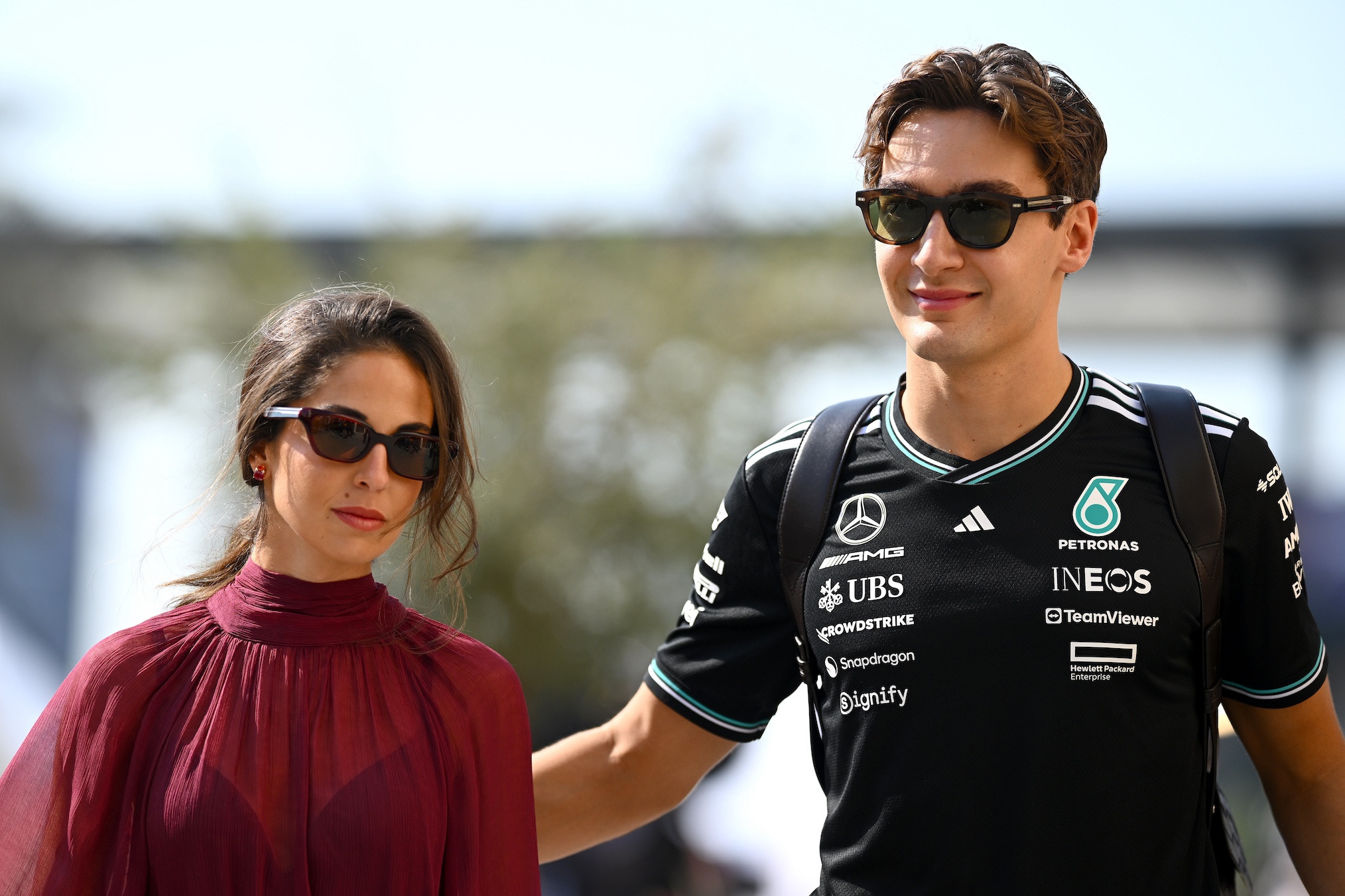 George Russell of Great Britain and Mercedes AMG Petronas F1 Team in the Paddock with Carmen Montero Mundt prior to the F1 Grand Prix of Abu Dhabi at Yas Marina Circuit on December 07, 2025 in Abu Dhabi, United Arab Emirates.