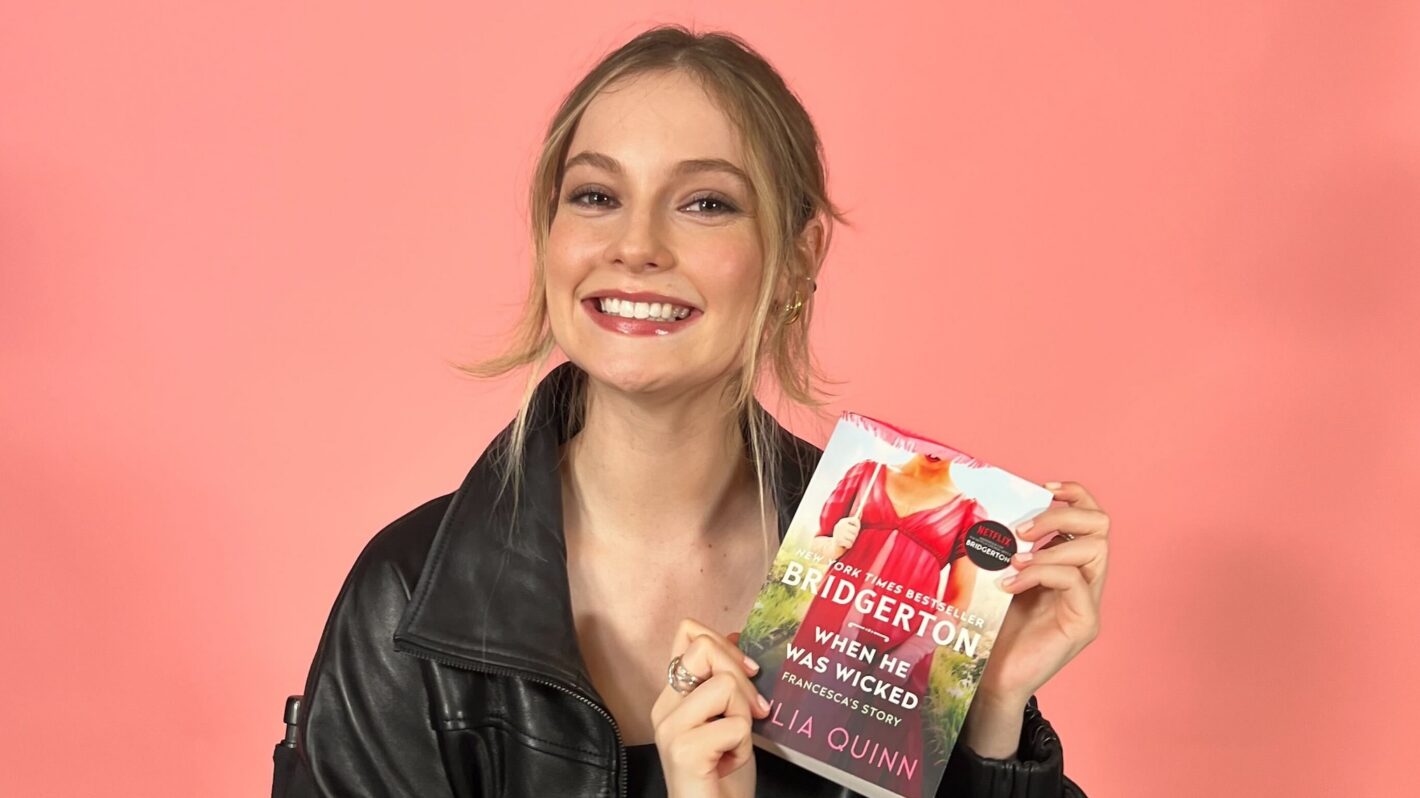 Hannah Dodd holding the book 'When He Was Wicked' by Julia Quinn