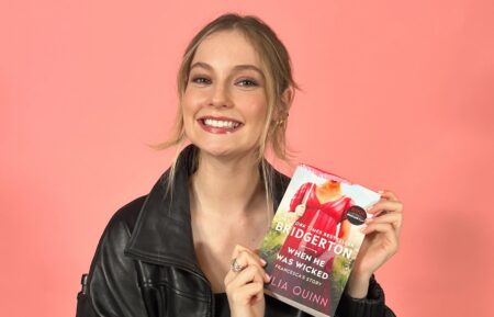 Hannah Dodd holding the book 'When He Was Wicked' by Julia Quinn