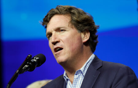 Tucker Carlson speaks during a Turning Point Action campaign rally on October 23, 2024, in Duluth, Georgia