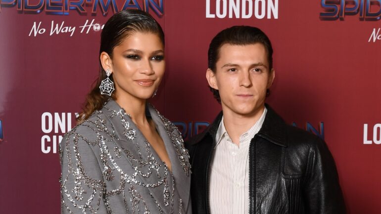Zendaya and Tom Holland attend a photocall for "Spiderman: No Way Home" at The Old Sessions House on December 05, 2021 in London, England.