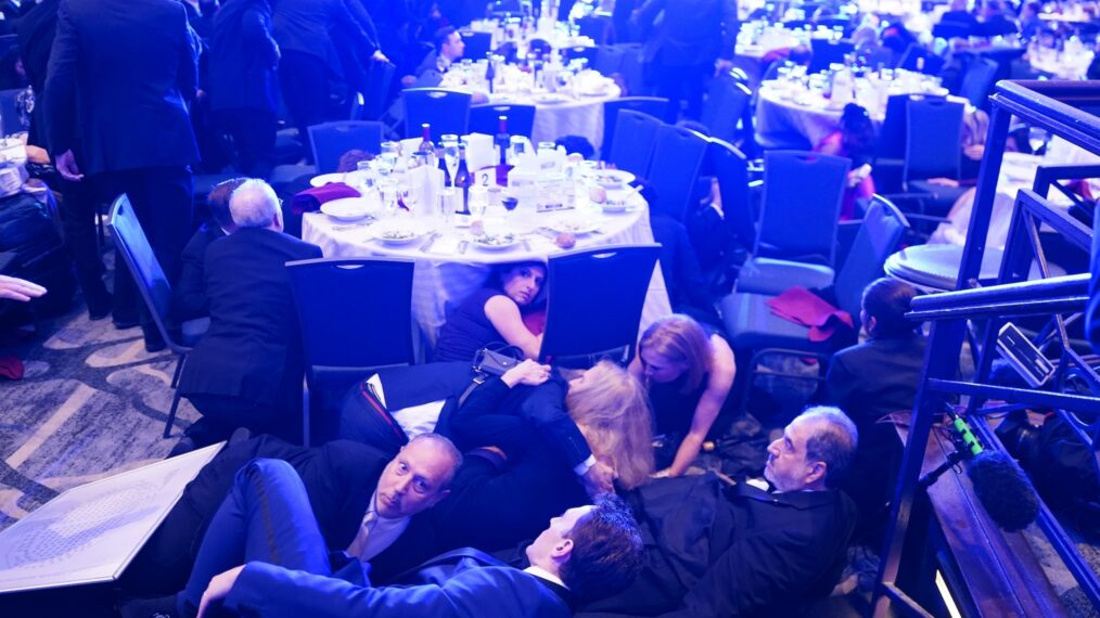 WASHINGTON, DC - APRIL 25: Attendees hide under tables after an incident at the annual White House Correspondents Association Dinner April 25, 2026 in Washington, DC. According to reports, President Donald Trump, along with other government officials, were evacuated from the Washington Hilton after what sounded like gun fire. (Photo by Nathan Howard/Getty Images)