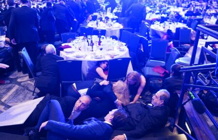 WASHINGTON, DC - APRIL 25: Attendees hide under tables after an incident at the annual White House Correspondents Association Dinner April 25, 2026 in Washington, DC. According to reports, President Donald Trump, along with other government officials, were evacuated from the Washington Hilton after what sounded like gun fire. (Photo by Nathan Howard/Getty Images)