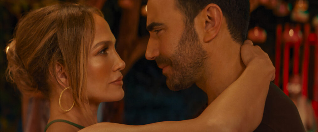 Jennifer Lopez as Jackie Cruz and Brett Goldstein as Daniel Blanchflower in Office Romance.