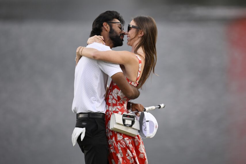 Akshay Bhatia of the United States embraces his wife Presleigh after winning the tournament on the eighteenth green during the first playoff hole at the Arnold Palmer Invitational presented by Mastercard 2026 at Arnold Palmer Bay Hill Golf Course on March 08, 2026 in Orlando, Florida.