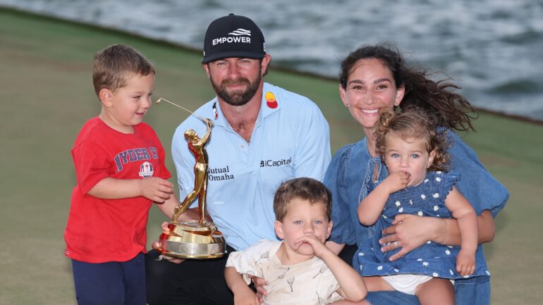 Cameron Young of the United States poses with the winner's trophy alongside wife Kelsey, sons John and Henry and daughter Vivienne after winning THE PLAYERS Championship 2026 at THE PLAYERS Stadium course at TPC Sawgrass on March 15, 2026 in Ponte Vedra Beach, Florida.