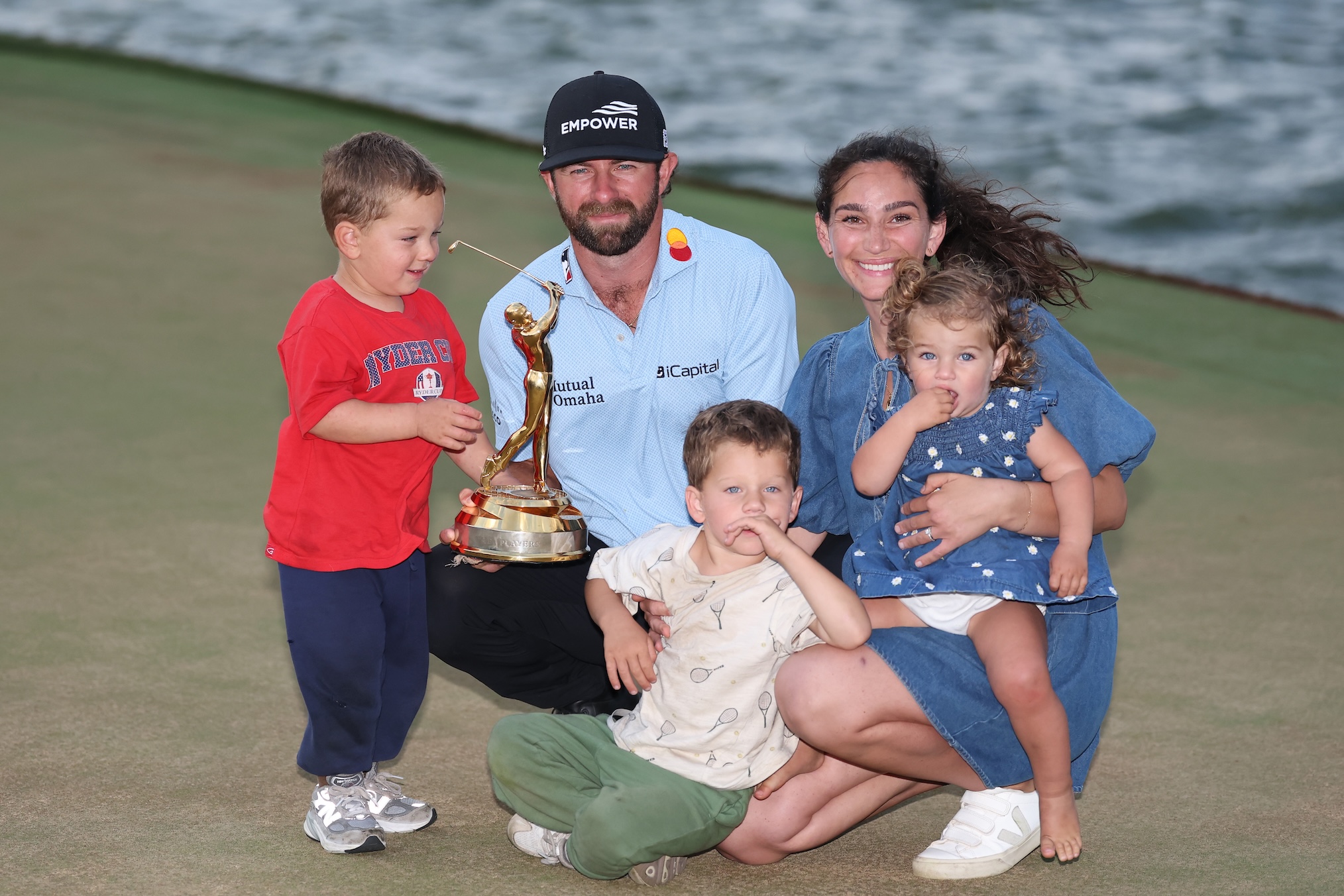 Cameron Young of the United States poses with the winner's trophy alongside wife Kelsey, sons John and Henry and daughter Vivienne after winning THE PLAYERS Championship 2026 at THE PLAYERS Stadium course at TPC Sawgrass on March 15, 2026 in Ponte Vedra Beach, Florida.
