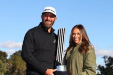 Captain Dustin Johnson of 4Aces GC poses with his wife Paulina Gretzky and the individual trophy after winning during day three of the LIV Golf Invitational - Las Vegas at Las Vegas Country Club on February 10, 2024 in Las Vegas, Nevada.