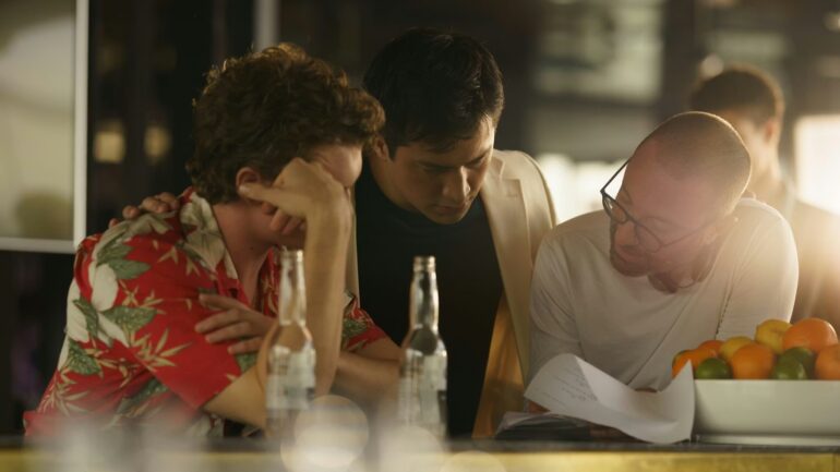 Connor Storrie, Hudson Williams, and Jacob Tierney on set of Heated Rivalry Season 1