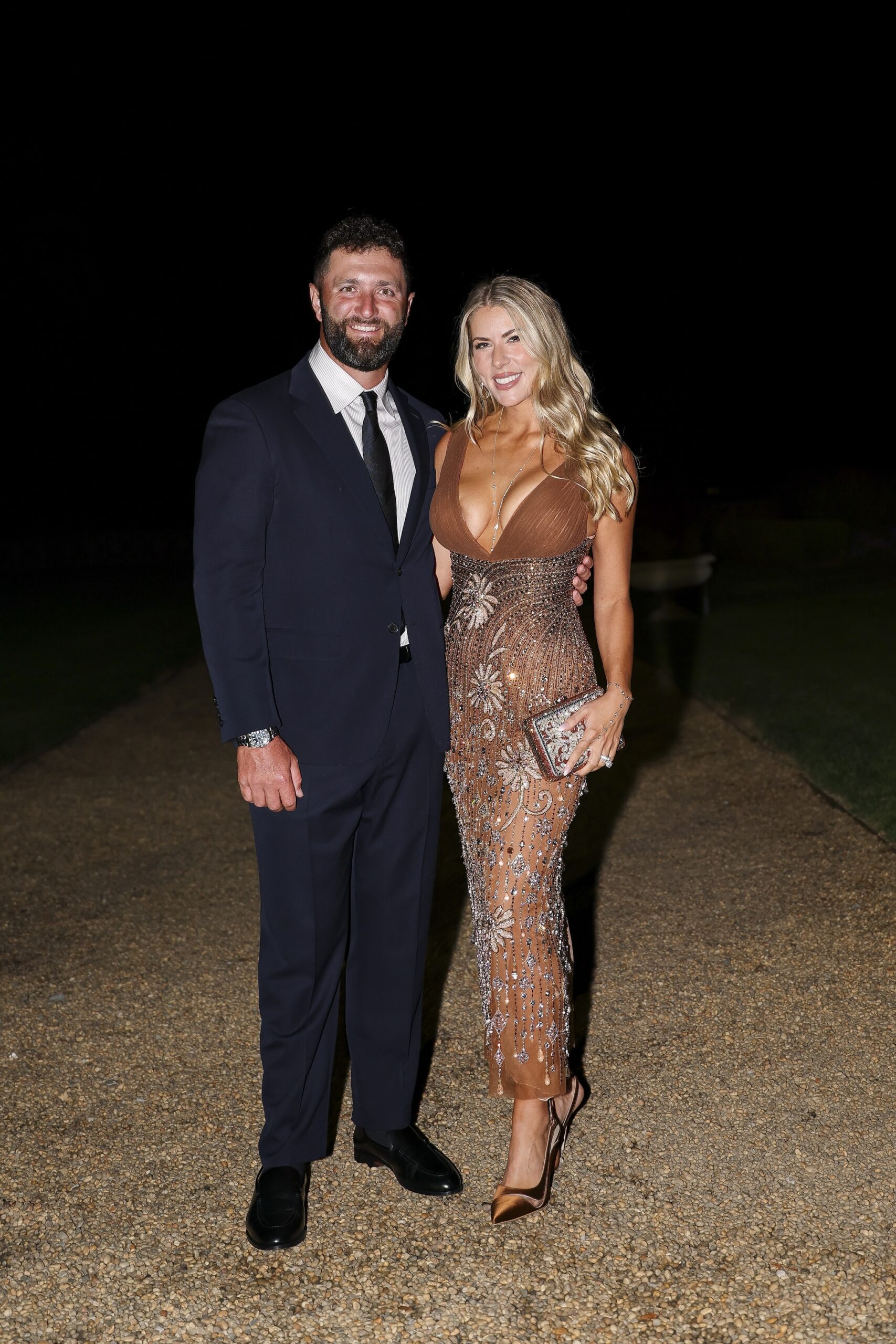 Jon Rahm of Team Europe and his wife Kelley Rahm pose for a photo during the Ryder Cup Teams' Welcome Dinner prior to the Ryder Cup 2025 at Hempstead House on September 23, 2025 in Sands Point, New York.