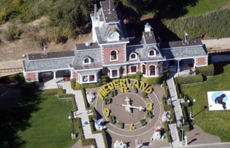 LOS OLIVOS, CA - NOVEMBER 18 : An aerial photo shows a Santa Barbara County Sheriff's vehicle in front of singer Michael Jackson's Neverland Ranch November 18, 2003 outside of Santa Barbara, California. Police armed with a search warrant swarmed Jackson's sprawling home in the Santa Ynez Valley. One media report said the warrant was tied to allegations brought by a 12-year-old boy. (Photo by Frazer Harrison/Getty Images)