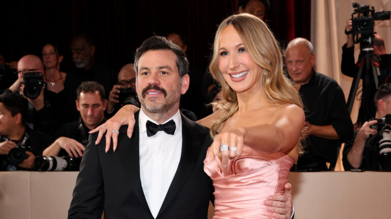 Chris Convy and Nikki Glaser attend the 83rd Annual Golden Globe Awards at The Beverly Hilton on January 11, 2026 in Beverly Hills, California