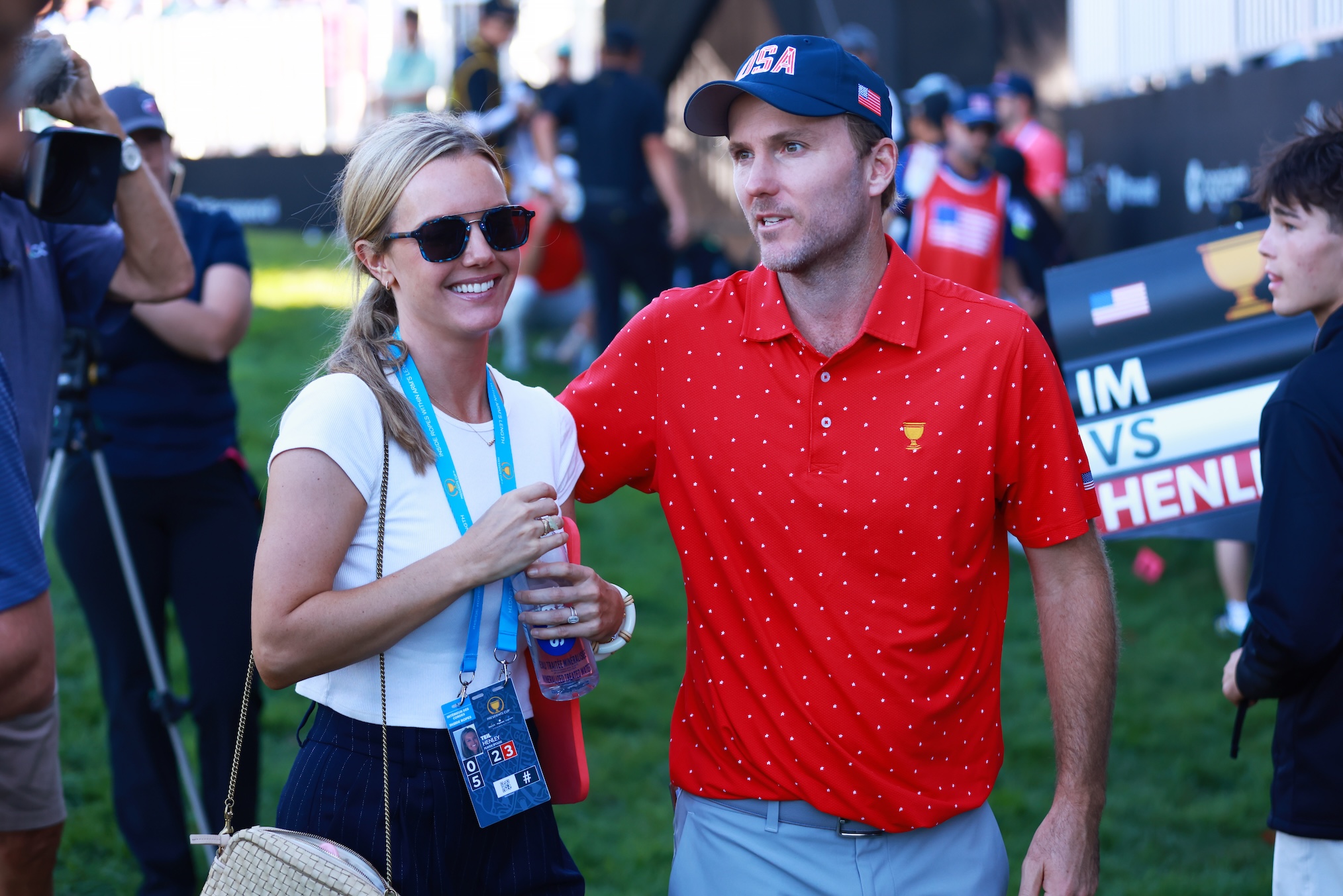 Russell Henley of the U.S. Team celebrates with wife Teil Henley after Henley defeated Sungjae Im of South Korea and the International Team 3&2 during Sunday Singles on day four of the 2024 Presidents Cup at The Royal Montreal Golf Club on September 29, 2024 in Montreal, Quebec, Canada.