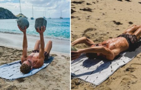 Ryan Seacrest exercising on the beach with rocks on Earth Day