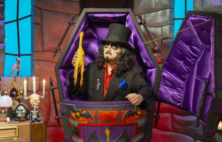 Svengoolie with rubber chicken in coffing