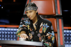 Alicia Keys pressing the buzzer on The Voice