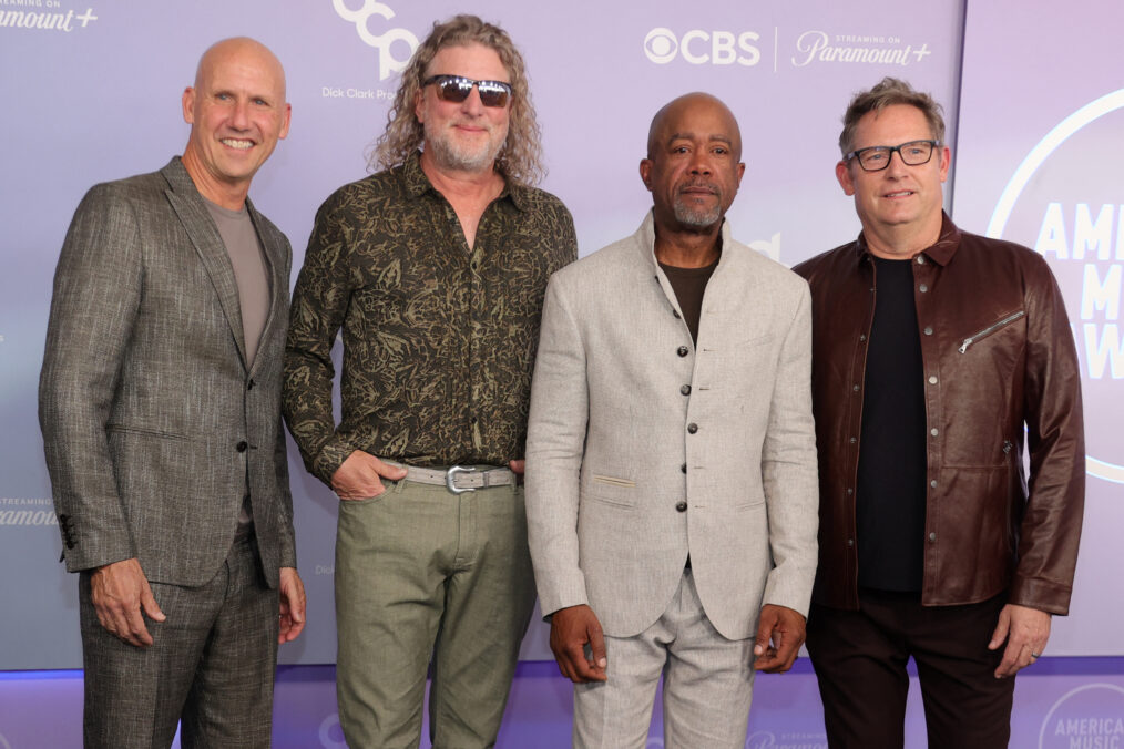 (L/R) Jim Sonefeld, Mark Bryan, Darius Rucker and Dean Felber, of the US band Hootie & the Blowfish, attend the American Music Awards at the MGM Grand Garden Arena in Las Vegas, Nevada on May 25, 2026. (Photo by Ian Maule / AFP via Getty Images)