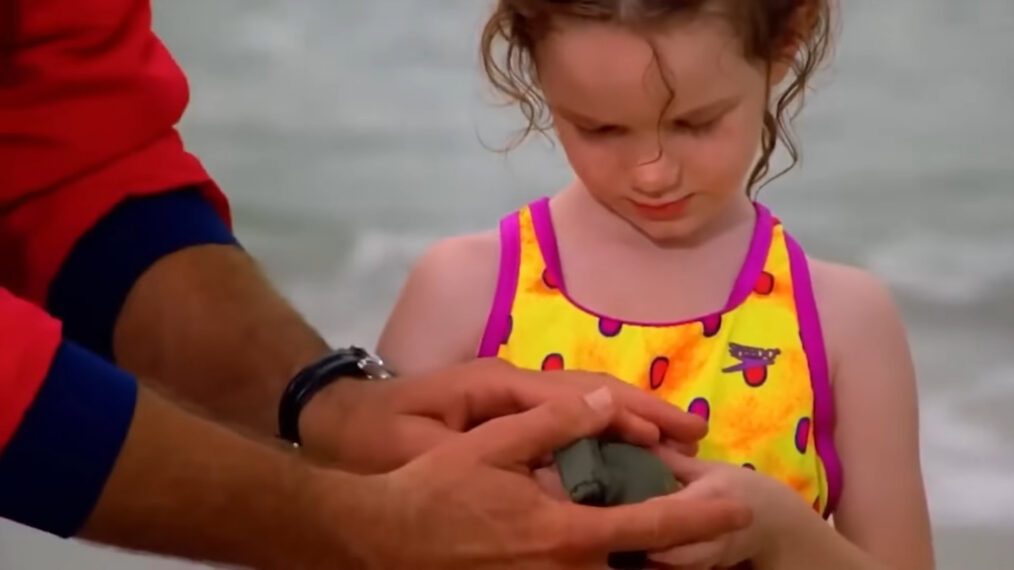 A girl holding a grenade on 'Baywatch'