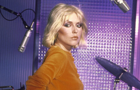 Deborah Harry, lead singer of new wave group Blondie wearing Gloria Vanderbilt's Murjani jeans while making commercial for jeans.