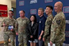 Ken Jennings posing with military members