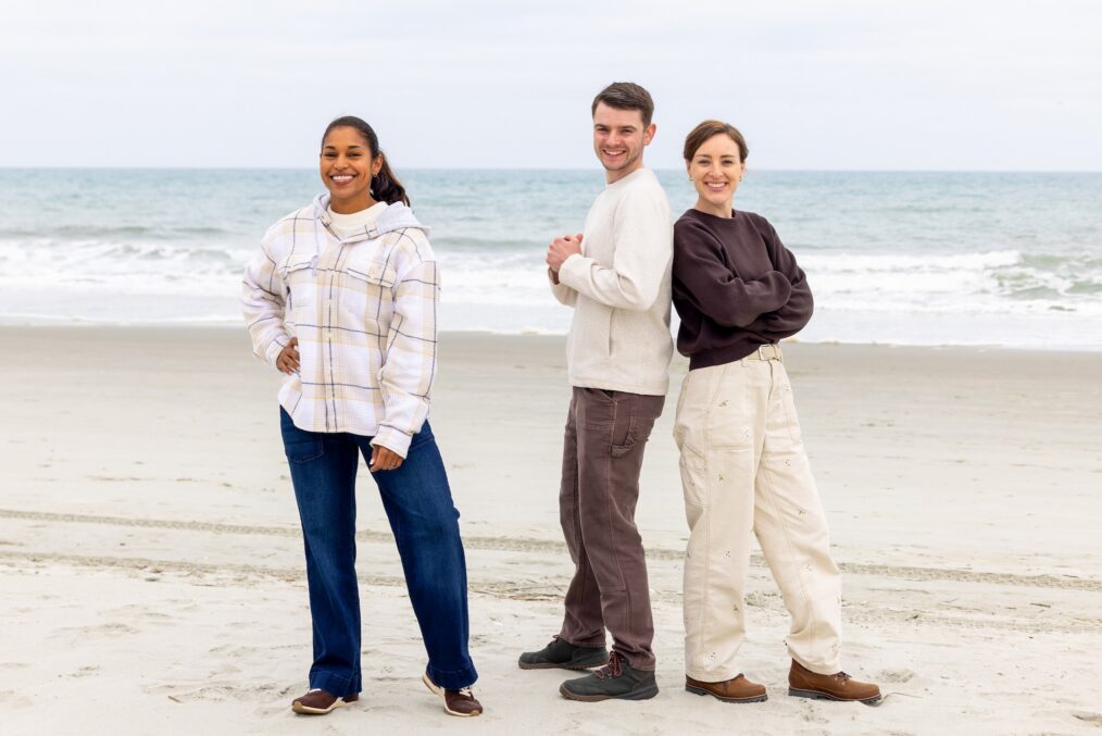 Mika Kleinschmidt poses with her team of Anna and Josiah Julian, 'Battle on the Beach' Season 5, HGTV, premiered June 1, 2026.