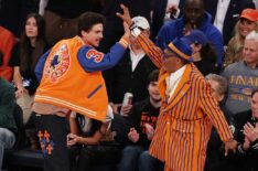 Miles Teller looks on as Timothee Chalamet and Spike Lee high five during the first quarter between the Indiana Pacers and the New York Knicks in Game Five of the Eastern Conference Finals of the 2025 NBA Playoffs at Madison Square Garden on May 29, 2025 in New York City.