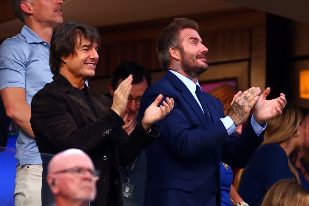 LOS ANGELES, CALIFORNIA - JUNE 12: Tom Cruise (L) and David Beckham applaud during the FIFA World Cup 2026 Group D match between USA and Paraguay at Los Angeles Stadium on June 12, 2026 in Los Angeles, California. (Photo by Chris Brunskill/Fantasista/Getty Images)