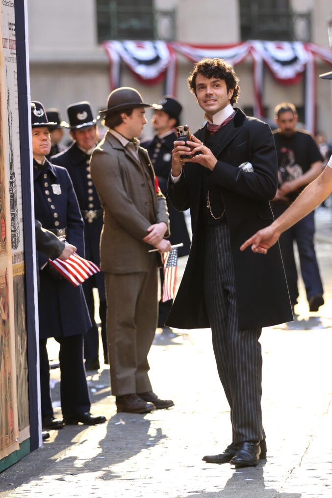 Actors are seen at "The Gilded Age" set in Wall Street, Manhattan. on May 16, 2026 in New York City.