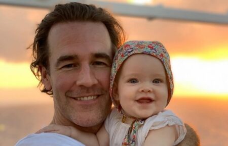 James Van Der Beek posing with one of his children
