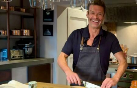 Ryan Seacrest cooking in his kitchen as fans think he has a girlfriend