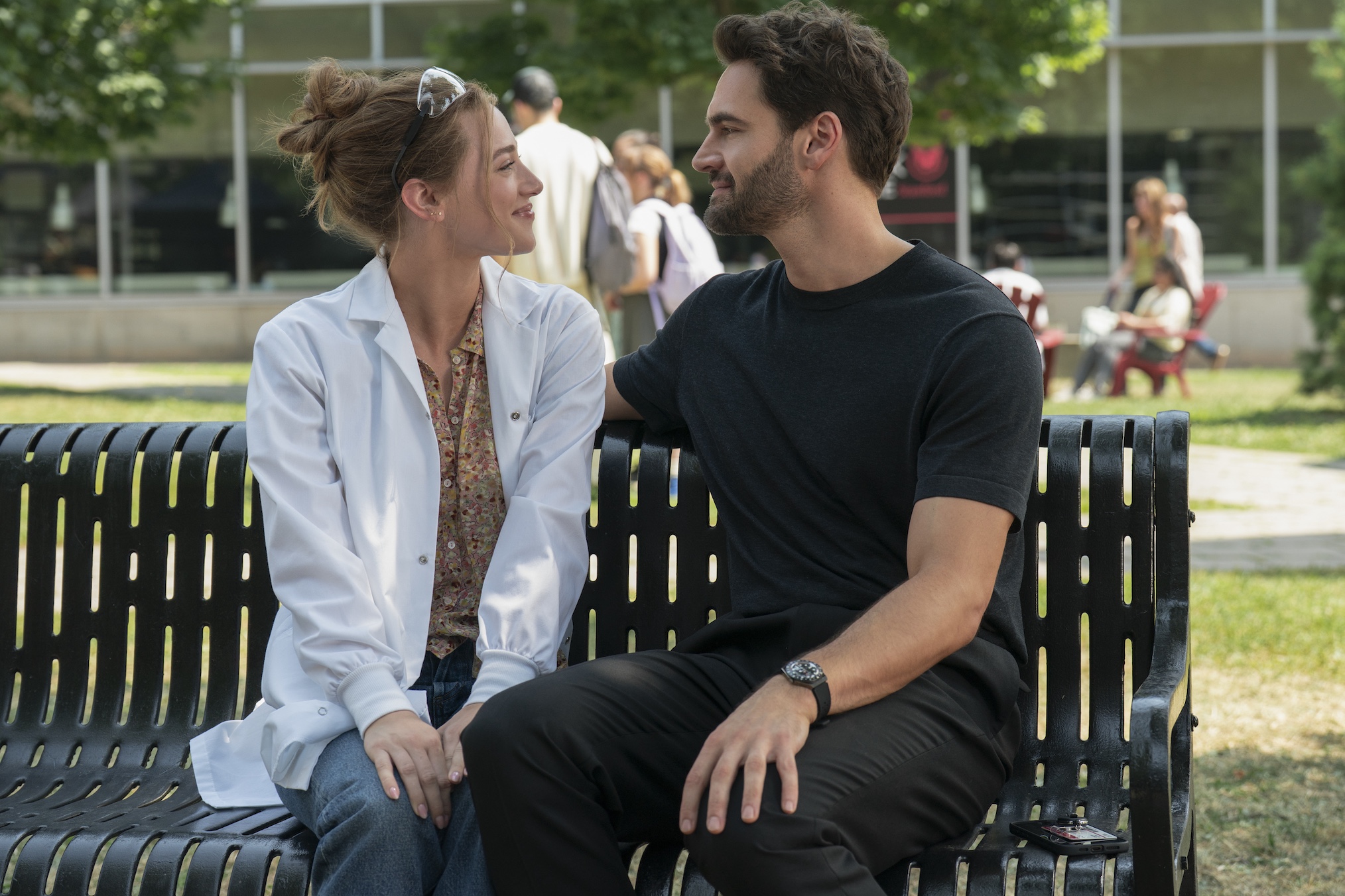 'The Love Hypothesis' Adam and Olive sit on a bench