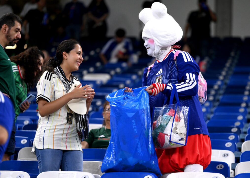 GUADALUPE, MEXICO - JUNE 20: Japan fans clear trash from the stands after the FIFA World Cup 2026 Group F match between Tunisia and Japan at Monterrey Stadium on June 20, 2026 in Guadalupe, Mexico. (Photo by David Ramos/Getty Images)