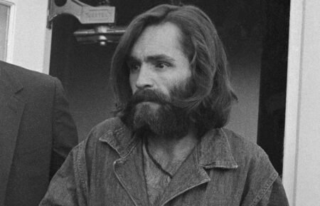 (Original Caption) Charles Manson, 34, arrives at the Inyo County Courthouse December 3rd for a preliminary hearing on charges of arson and receiving stolen goods. The leader of a quasi-religious hippie group and four of his followers have been indicted for the August 9th murders of actress Sharon Tate and four other persons