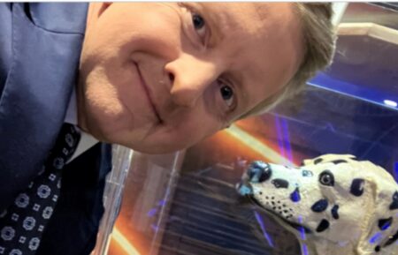 Ken Jennings taking a photo with "Wheel of Fortune" mascot Sheldon