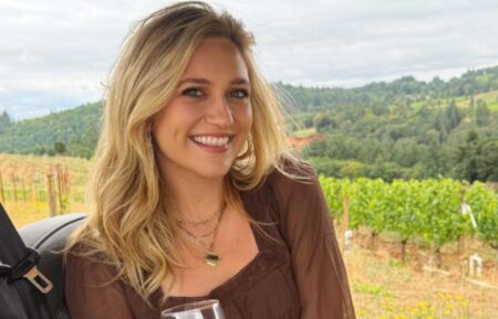 Maggie Sajak sitting in a golf cart on a wine vineyard