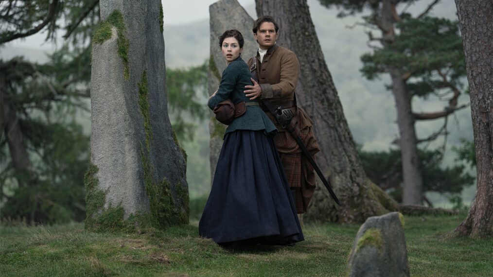 Hermione Corfield and Jeremy Irvine in 'Outlander: Blood of My Blood' Season 2