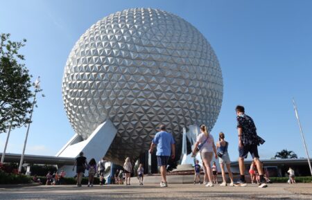 ORLANDO, FL - APRIL 1: People enter the grounds of Epcot at Walt Disney World on April 1, 2025, in Orlando, Florida. (Photo by Gary Hershorn/Getty Images)