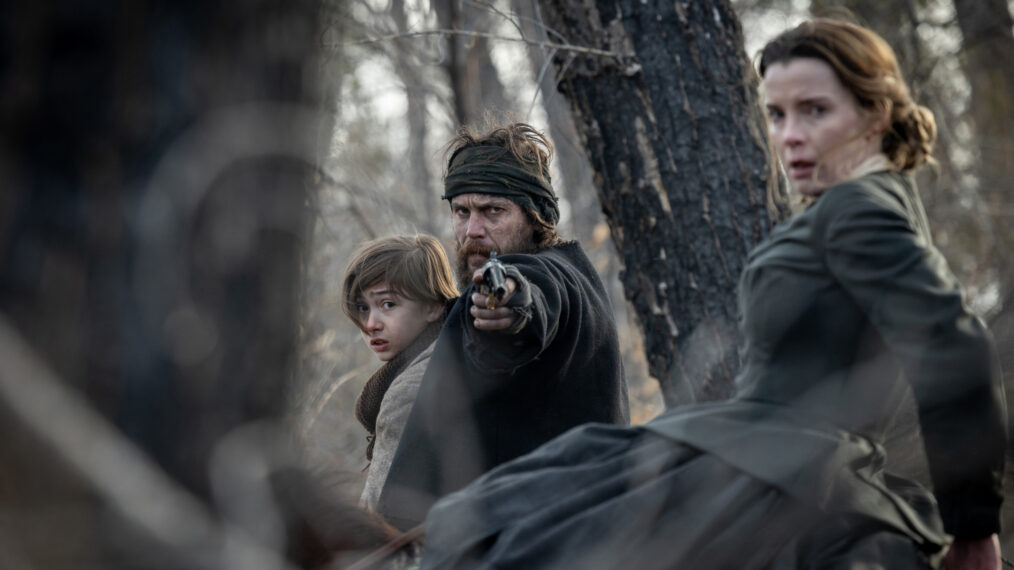 Preston Mota as Devin Rowell, Taylor Kitsch as Isaac, and Betty Gilpin as Sara Rowell in ‘American Primeval’