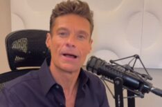 Ryan Seacrest sitting in his chair for his radio show