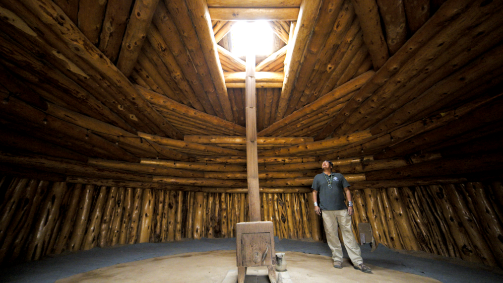NOVAKnowledge Keepers Robert Nutlouis stands in a completed hogan in Navajo Nation