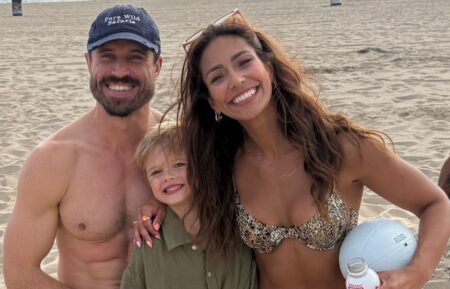 "The Price Is Right" models (left) James O'Halloran and Manuela Arbeláez on the beach with O'Halloran's son