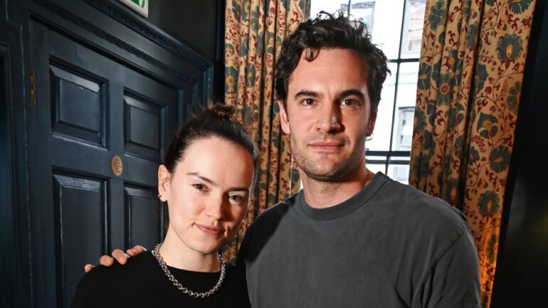 : Daisy Ridley and Tom Bateman attend the "Train Dreams" lunch reception at Soho House on November 19, 2025 in London, England.