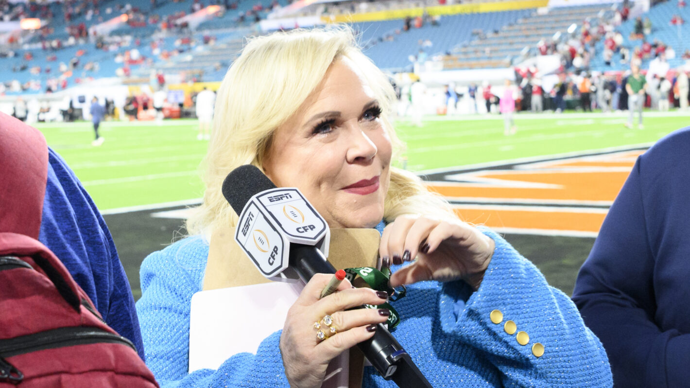 ESPN sideline reporter Holly Rowe gestures to the fans from on the sidelines before the Indiana Hoosiers versus the Miami Hurricanes College Football Playoff National Championship