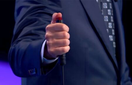 Ken Jennings holding a buzzer in a 'Jeopardy! Masters' promo