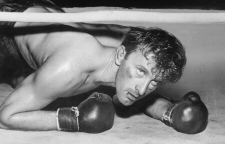 (Original Caption) Kirk Douglas is shown in a scene from the movie The Champion, a movie directed by Mark Robson. The boxer character "Midge Kelly rises to fame...mainly due to stepping on other people."