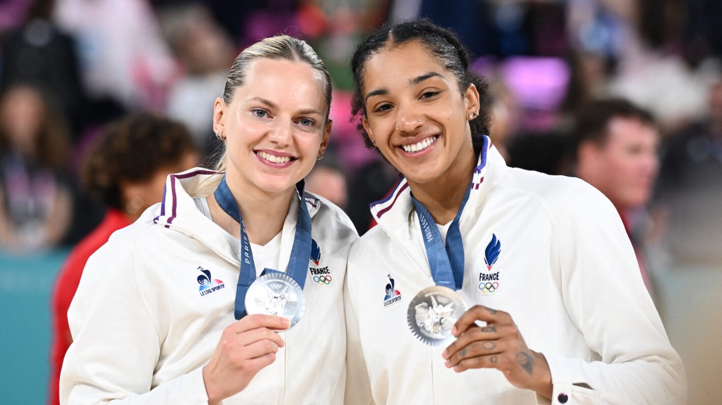 Silver medallists France's #23 Marine Johannes (L) and France's #15 Gabby Williams pose with their medal after the women's Gold Medal basketball match between France and the USA during the Paris 2024 Olympic Games at the Bercy Arena in Paris on August 11, 2024.