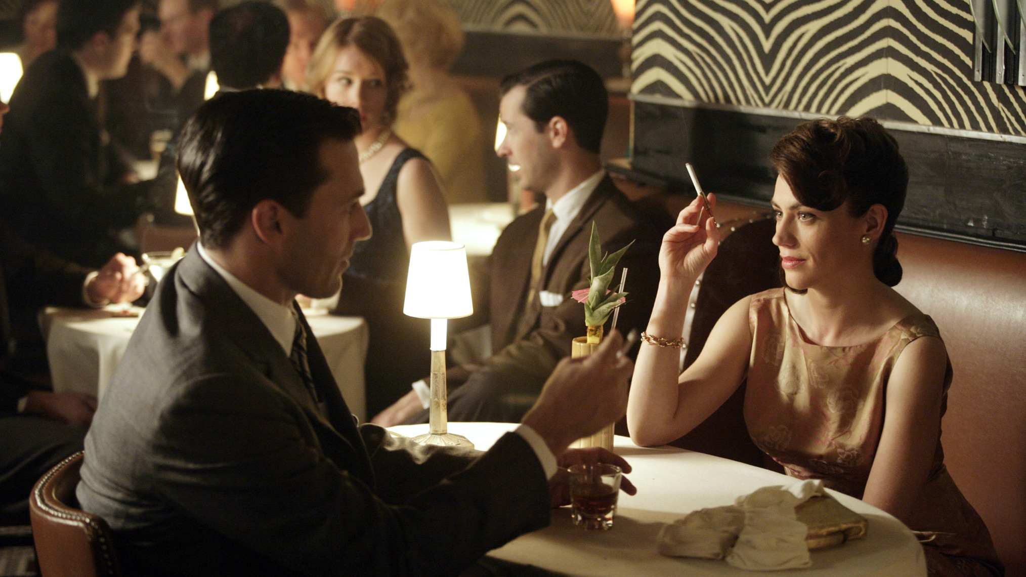Jon Hamm as Don Draper and Maggie Siff as Rachel Menken in ‘Mad Men’