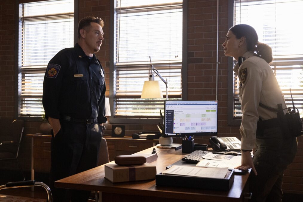 Kevin Alejandro as Manny Perez and Morena Baccarin as Sheriff Mickey Fox — 'Sheriff Country' & 'Fire Country' Crossover "No Way In"